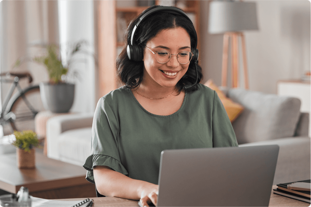 Woman with headphones on computer