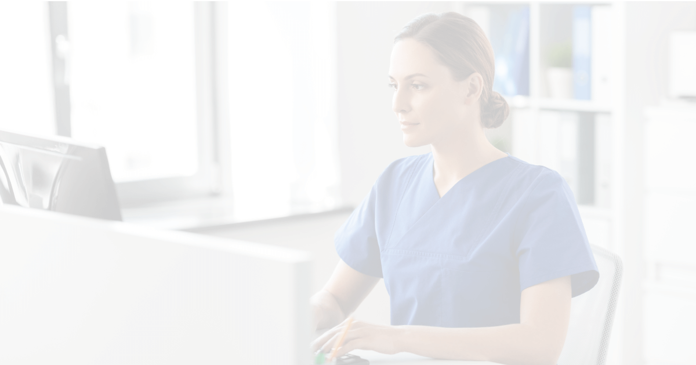 Female doctor looking at computer
