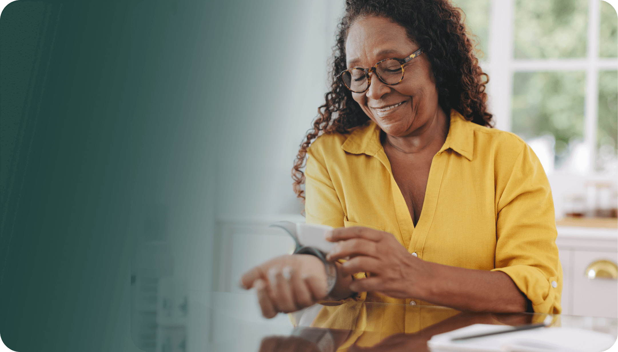 Woman measuring her own blood pressure with medical device