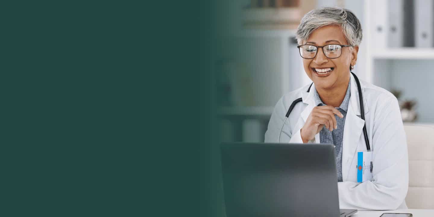 Female doctor using laptop