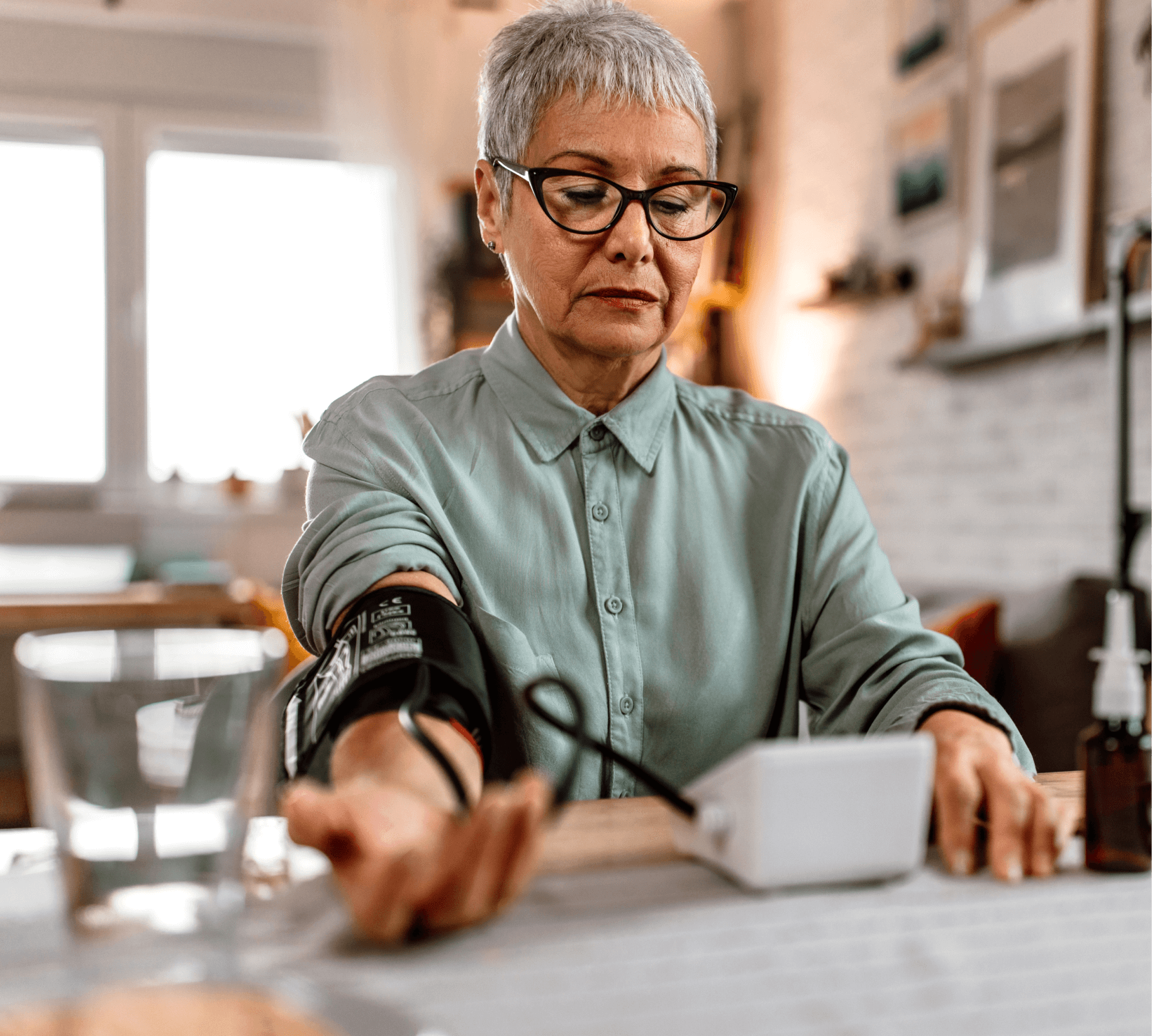 Woman using blood pressure device