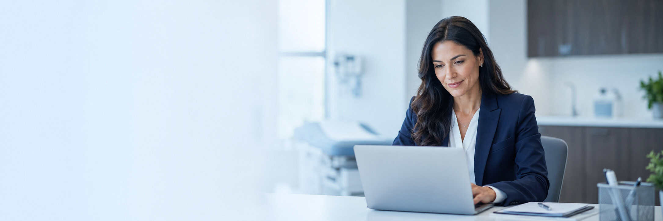 Practice administrator reviewing HIPAA compliance documentation for a remote patient monitoring vendor