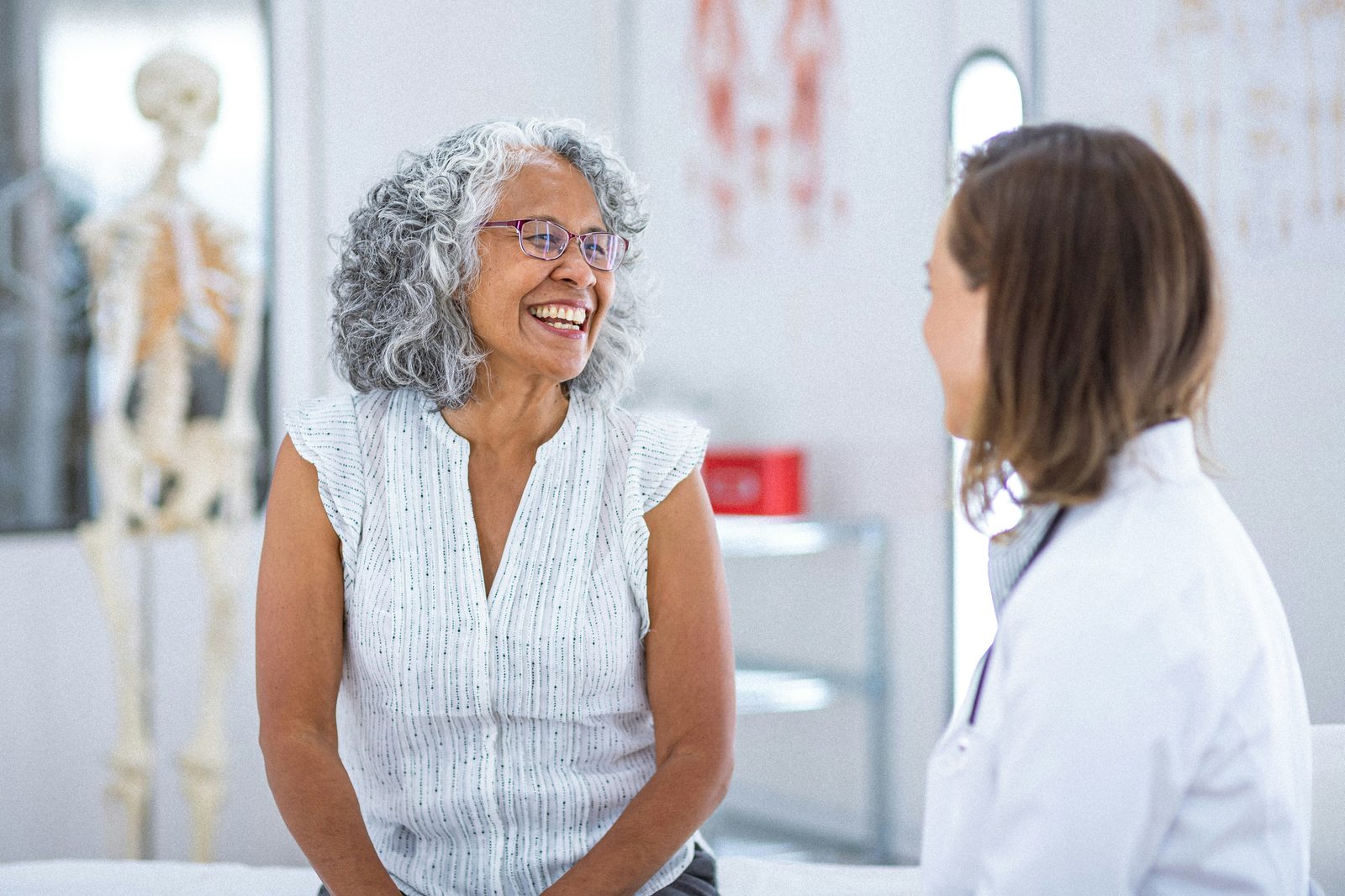 Patient and provider talking in an exam room, trust and privacy in Vivo Care remote care