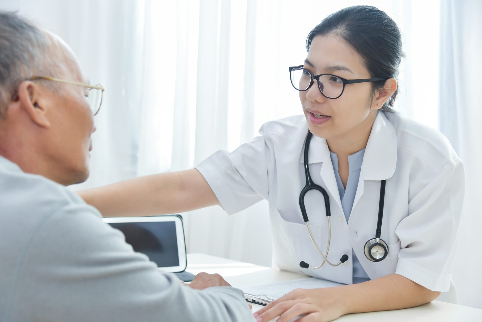 Provider showing empathy and trust with an older patient, Vivo Care remote care